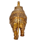 Brass elephant figurine back view with textured engraved shell-like patterns
