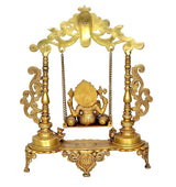 Brass Ganesha swing stand with Kirtimukha top and decorative side columns, gold