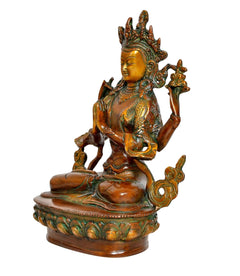 Brass Tara Devi statue, side view: seated on lotus base, green-gold ornamented robe details