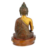 Medicine Buddha statue back view, beaded crown and ornate draped robe