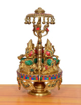 Brass Lakshmi-Ganesha-Saraswati idol with parasol and hanging bells, multicolor