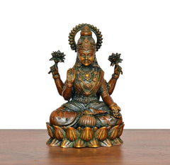 Lakshmi brass idol seated on a lotus base, front view with detailed jewelry and headdress