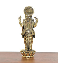Brass Lord Vishnu idol from behind, circular halo detail and lotus base