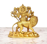 Back view golden brass Durga Maa and lion statue with round halo, 9 inch