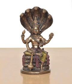 Vishnu resin figurine seated on Sheshnag coils, ornate crown, multicolor accents