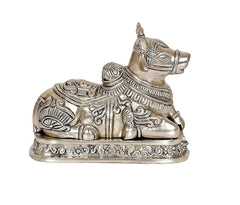 Nandi cow statue idol in brass tone, side view, detailed carvings and pedestal