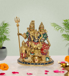 Brass Shiv Parivar idol with trident and family figures, on decorated round base