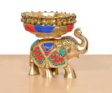 Brass elephant idol with empty urli bowl, multicolor gemstone-style inlay and handle