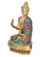 Side view brass meditating Buddha statue with colorful inlaid robe and lotus pedestal