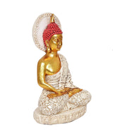 Buddha idol three-quarter view, red jeweled headpiece, gold skin, white detailed robe