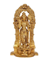 Brass Vishnu idol front view, four arms behind decorative halo arch