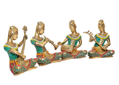 Four brass lady musician statues in seated playing poses, teal dresses, beaded details