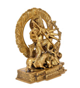 Brass Durga idol angled view, ten arms with weapons, circular halo ring