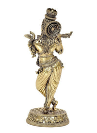 Rear view of gold-tone Lord Krishna idol playing flute on circular patterned base