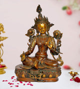 Brass Tara Devi seated deity statue, gold face, ornate headdress and floral arms