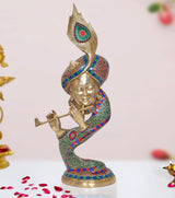 Brass Krishna flute idol with peacock mukut, colorful patterned robe, flute in hand