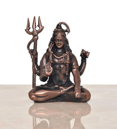 Lord Shiva idol in copper, seated with trident and blessing hand