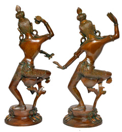 Brass Shiva-Parvati idols from the back view, seated-like dance stance and ornate back details