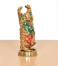 Brass laughing Buddha statue angled view, multicolor robe with jeweled trim