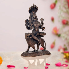 Pratyangira Devi copper statue on bull, side view, seated with trident-like arms
