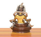 Brass Kuber Bhagwan murti, back view with arms framing the head and engraved base
