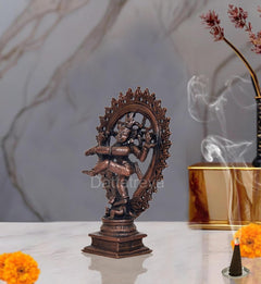 Copper Natraja dancing Shiva idol figurine, angled view with sculpted crown