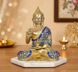 Brass Buddha idol in Abhaya mudra, seated on round base, blue and gold details
