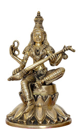 Brass Saraswati statue front view, seated posture holding veena on lap