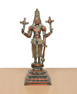 Standing Vishnu idol with four arms, brass finish, decorative waist ornaments and sandals