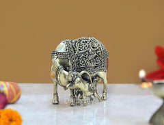 Brass cow with calf figurine, rear side view with engraved borders and patterns