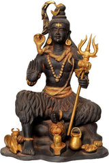 Lord Shiva deity figurine seated, holding trident and raised hand, ornate gold accents