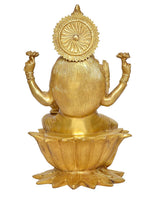 Brass Lakshmi idol back view with halo disc, seated on lotus base, gold tone