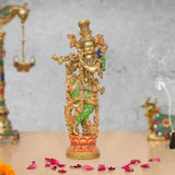 Brass Lord Krishna idol playing flute with meenakari-style colorful detailing, full figure