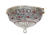 Brass deity Chattar front view: ornate silver scrollwork with red gems, hanging finial