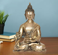 Brass meditating Buddha statue with lotus hand, seated posture, dark beaded hair