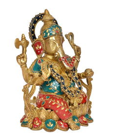 Ganpati brass statue in side view, teal headpiece with beads and red ear accents
