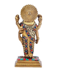 Brass Dhanvantari statue back view, radiant halo, jeweled blue-red robe, raised arms