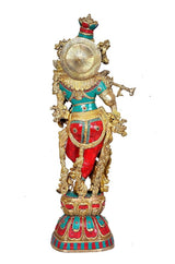 Brass Krishna murti back-left view, circular halo detail, red and teal outfit, standing on base