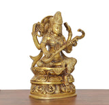 Brass Saraswati idol from side, detailed ornaments and veena in her hands
