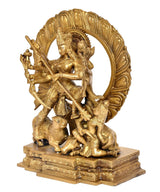 Brass Durga idol side view, circular halo with ten-armed goddess and demons