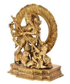 Brass Durga idol side view, circular halo with ten-armed goddess and demons