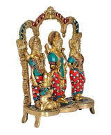 Ram Darbar brass idol from side angle, three figures with jeweled teal-red outfits