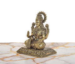 Superfine brass Lakshmi statue, seated pose with halo-like headpiece and jewelry