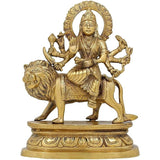 Brass Durga idol statue on lion with multi-armed pose and ornate halo