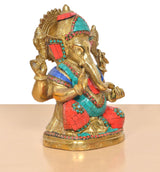 Ganpati Bappa murti side view with gold hands, teal and red mosaic, jeweled ornaments