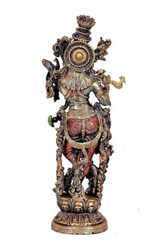 Krishna statue back view, circular halo detail, ornate garments and ornaments