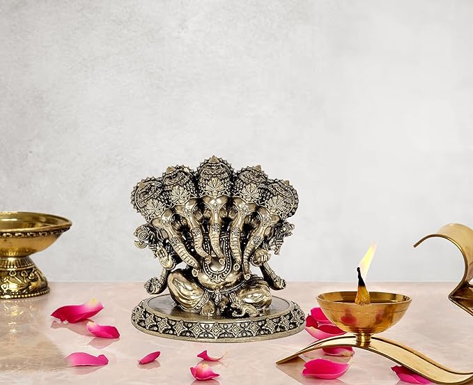 Brass Panchmukhi Ganesha idol on round base, detailed multi-face design