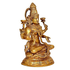 Brass Lakshmi statue side view, four arms holding diya-style candle stands