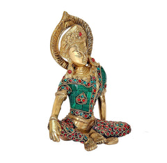 Brass Indra Dev statue, front-angled seated figure, teal dress with red jewel borders