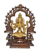 Brass Lakshmi statue front view with crown and halo arch, seated cross-legged on lotus